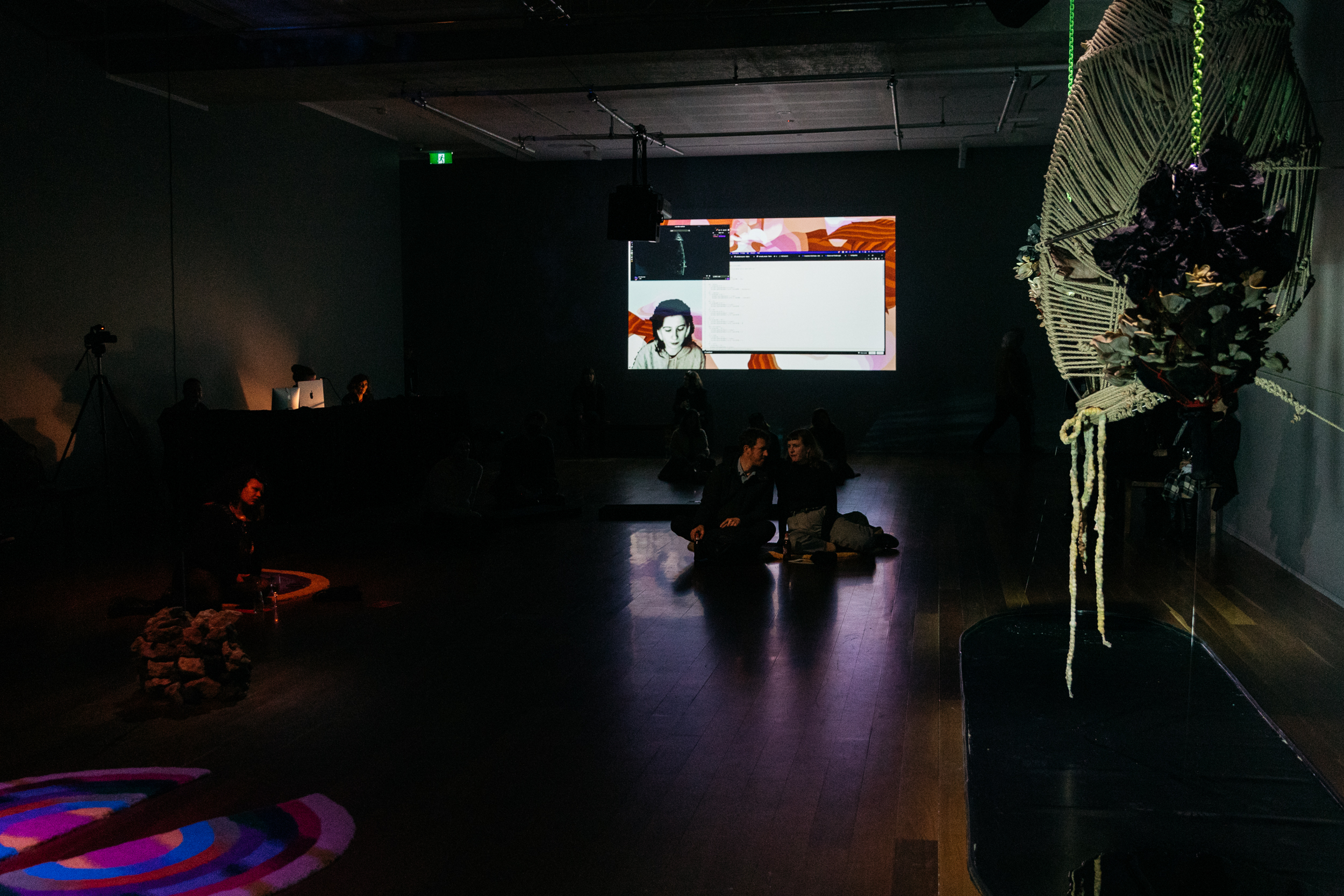 Exosmosis — gallery wide view with audience and live stream projection, Samstag Museum of Art, 2022