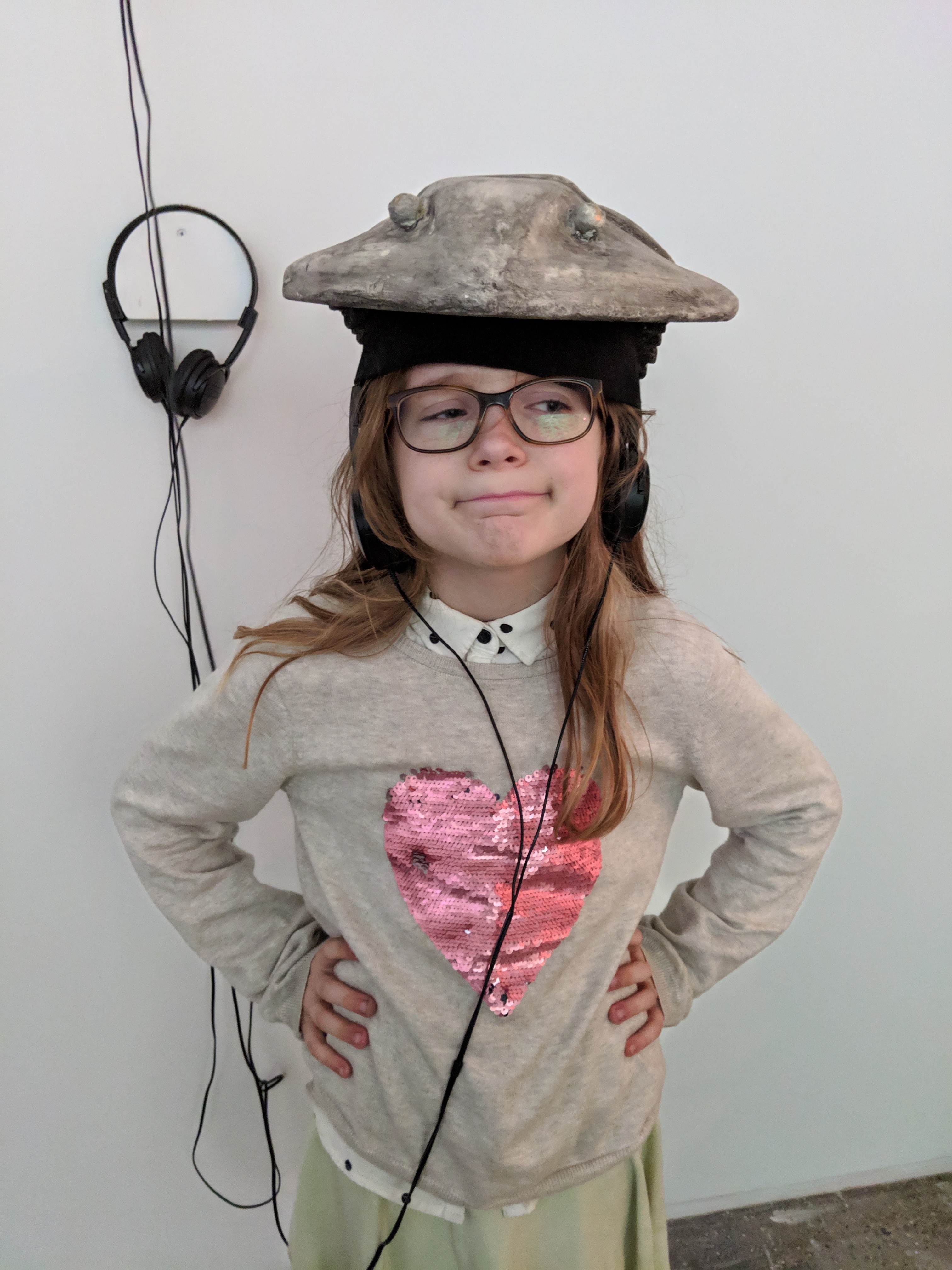 visitor wearing the head sculpture, her eyes were as black as coal, sound, video and sculptural installation by virginia barratt and francesca da rimini, hudson gallery, new york, 2019